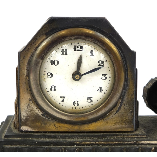 293 - Two Military interest French Art Deco desk clocks, one mounted with an armoured car the other with a... 