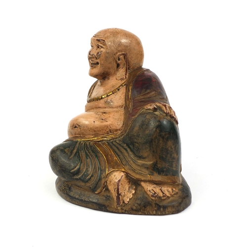 478 - Chinese carved wooden Buddha with hand painted and gilded decoration, 30cm high