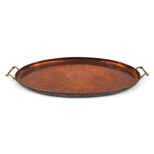 637 - Arts & Crafts Hugh Wallis copper and brass twin handled tray, with central floral motif and all over... 