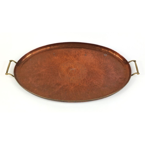 637 - Arts & Crafts Hugh Wallis copper and brass twin handled tray, with central floral motif and all over... 