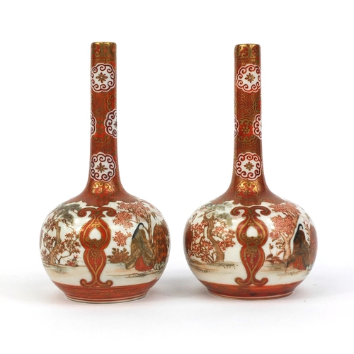 427 - Pair of Japanese Kutani porcelain bottle vases, hand painted with figures in an exterior amongst flo... 