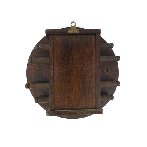 20 - Vintage circular oak wall day date calendar, 23cm in diameter