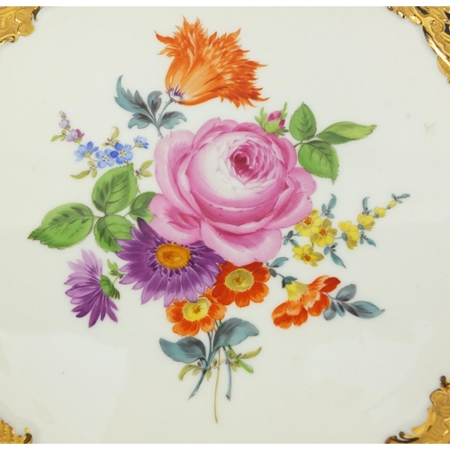 554 - Meissen porcelain cabinet plate hand painted with flowers, within a gilt foliate border onto a cobal... 