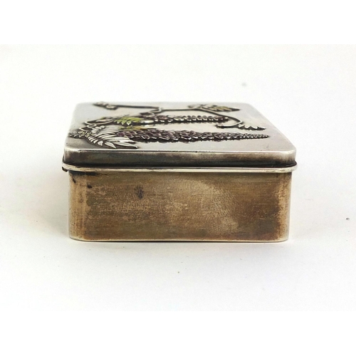 445 - Japanese Bisansha silver and enamelled box, the hinged lid cast in low relief with flowers stamp mar... 