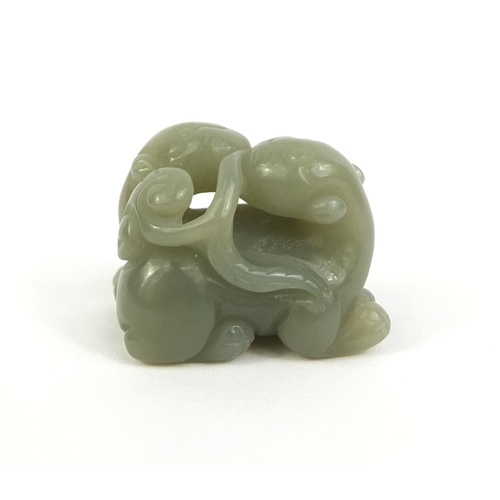 437 - Chinese carved green jade group of two entwined mythical creatures, 3.2cm high