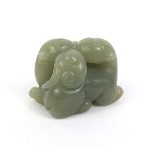 437 - Chinese carved green jade group of two entwined mythical creatures, 3.2cm high