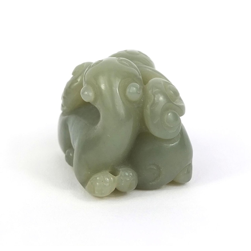 437 - Chinese carved green jade group of two entwined mythical creatures, 3.2cm high