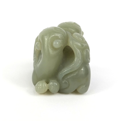 437 - Chinese carved green jade group of two entwined mythical creatures, 3.2cm high