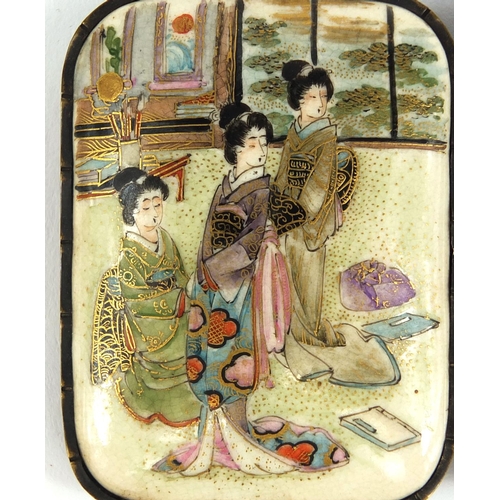 431 - Japanese Satsuma pottery two piece buckle, hand painted with robed ladies in an interior, 9cm wide