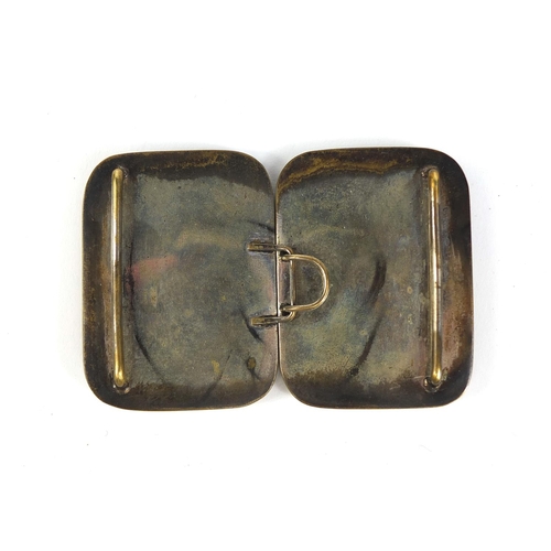 431 - Japanese Satsuma pottery two piece buckle, hand painted with robed ladies in an interior, 9cm wide