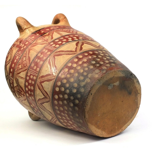 522 - Large Middle Eastern terracotta four handled vessel, finger painted with geometric motifs, 59cm high