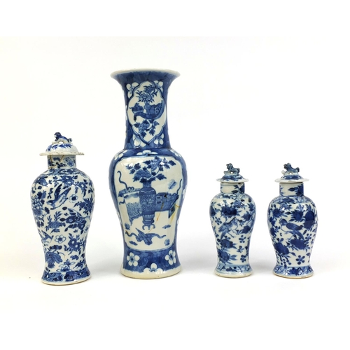 407 - Group of four Chinese blue and white porcelain vases, comprising a baluster example, hand painted wi... 