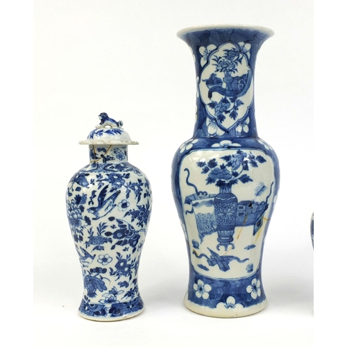 407 - Group of four Chinese blue and white porcelain vases, comprising a baluster example, hand painted wi... 