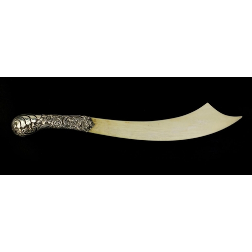 674 - Victorian silver and ivory page turner in the form of a scimitar, the handle profusely embossed with... 