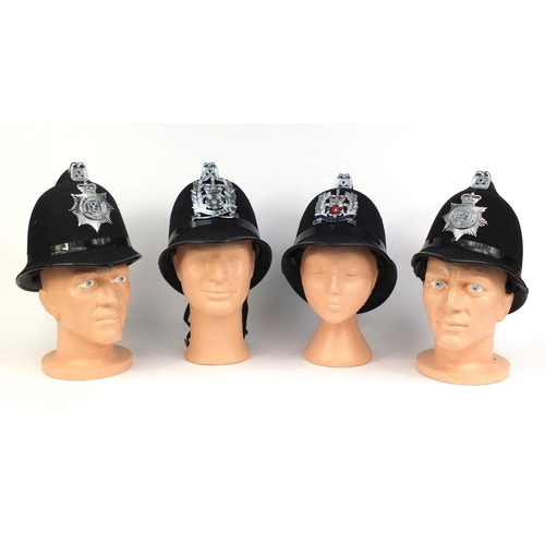 323 - Group of four vintage police Coxcomb helmets, comprising Derbyshire Constabulary, Derby County and B... 