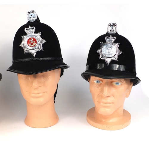 321 - Group of four vintage police Coxcomb helmets, comprising Kent Constabulary, West Yorkshire Metropoli... 