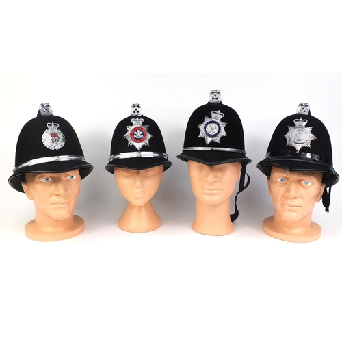 322 - Group of four vintage police Coxcomb helmets, comprising North Wales Police, South Wales Police, Sou... 