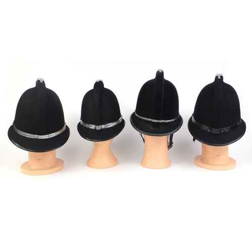322 - Group of four vintage police Coxcomb helmets, comprising North Wales Police, South Wales Police, Sou... 
