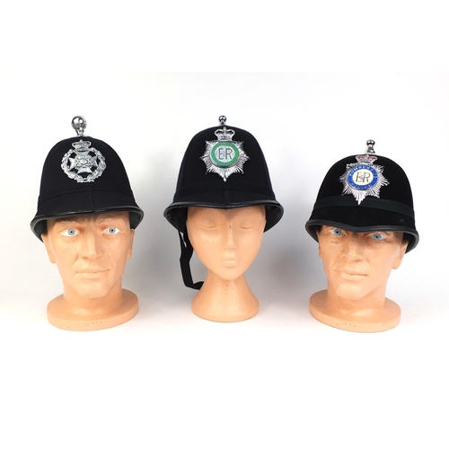 325 - Group of three vintage police Ball top helmets, comprising Humberside Police, Royal Parks Constabula... 