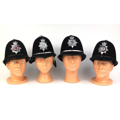 327 - Group of four vintage police Rose top helmets, comprising Avon and Somerset Constabulary, Lancashire... 