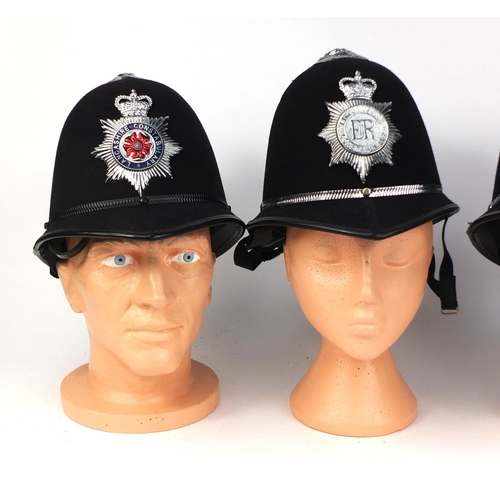 327 - Group of four vintage police Rose top helmets, comprising Avon and Somerset Constabulary, Lancashire... 