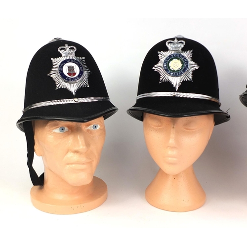 329 - Group of four vintage police Rose top helmets, comprising Worcester Constabulary, Royal Gibraltar, a... 