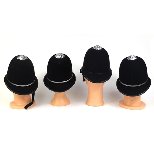 329 - Group of four vintage police Rose top helmets, comprising Worcester Constabulary, Royal Gibraltar, a... 