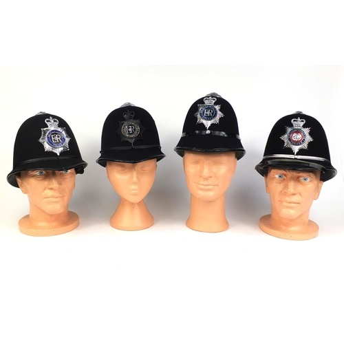 330 - Group of four vintage police Rose top helmets, comprising Gloucestershire Constabulary, Northamptons... 