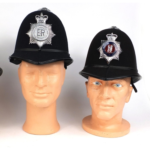 332 - Group of four vintage police Rose top helmets, comprising West Middlelands police, Rutland Constabul... 