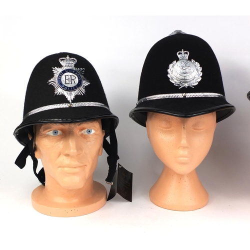 332 - Group of four vintage police Rose top helmets, comprising West Middlelands police, Rutland Constabul... 