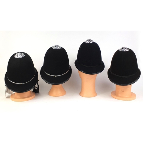 332 - Group of four vintage police Rose top helmets, comprising West Middlelands police, Rutland Constabul... 