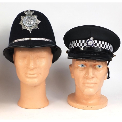 335 - Two vintage Ministry of Defence Police Peak caps together with two vintage police Rose top helmets c... 