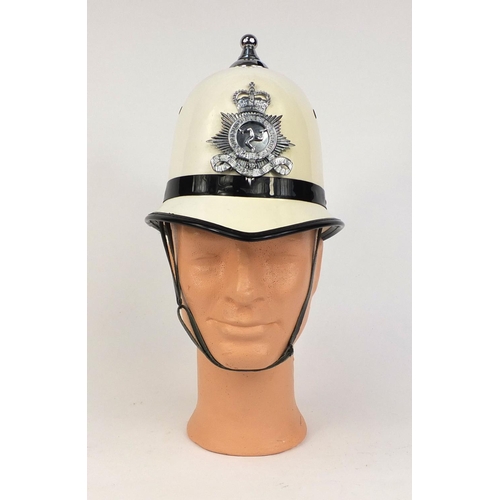 315 - Vintage Isles of Man police Ball top helmet, with Queens star badge and chin strap, size 54, 23cm hi... 