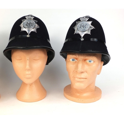 334 - Three vintage police helmets comprising a Coxcomb Durham Constabulary examples, and two Rose top Sou... 