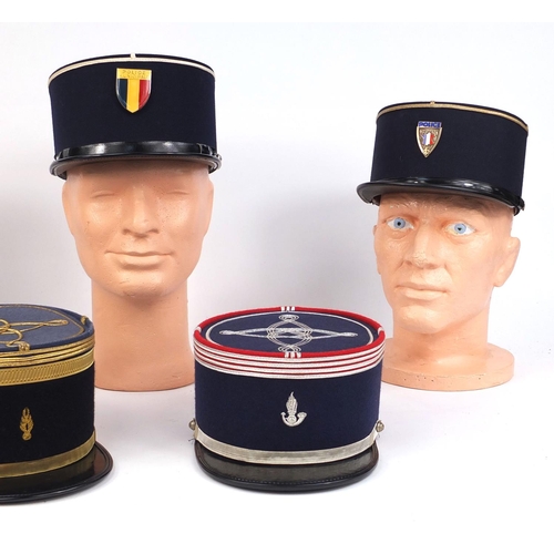 338 - Group of five vintage French police Kepi caps some embroidered and two with badges, some named to th... 