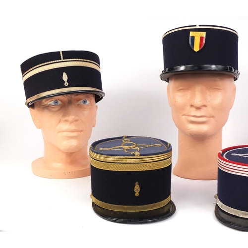 338 - Group of five vintage French police Kepi caps some embroidered and two with badges, some named to th... 