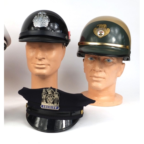 350 - Group of six police helmets/peak caps including a Sheriffs motorcycle hard hat and a Marshals motorc... 