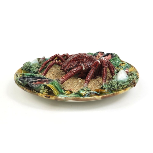 2235 - Large continental pottery Majolica crab dish decorated in relief with a crab, sea shells and seaweed... 