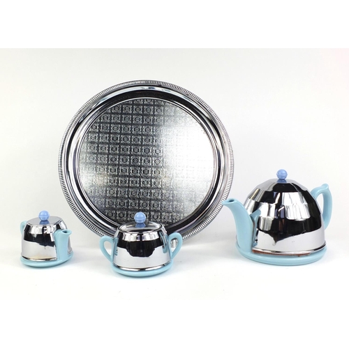 2278 - Art Deco three piece tea set comprising teapot, sugar bowl and milk jug, on a circular metal tray