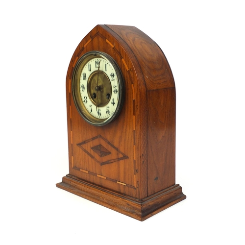 2230 - Edwardian inlaid arch top striking mantle clock with enamelled dial, 32cm high