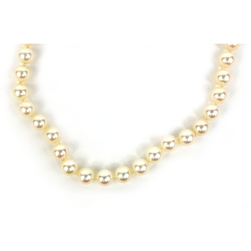 773 - Single string cultured pearl necklace with 18ct gold and diamond clasp, 40cm long, approximate weigh... 