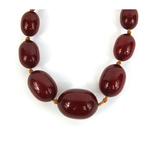 851 - Cherry amber coloured bead necklace, 42cm long, approximate weight 19.0g