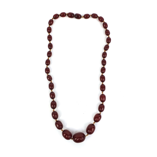 851 - Cherry amber coloured bead necklace, 42cm long, approximate weight 19.0g