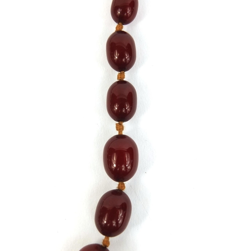 851 - Cherry amber coloured bead necklace, 42cm long, approximate weight 19.0g