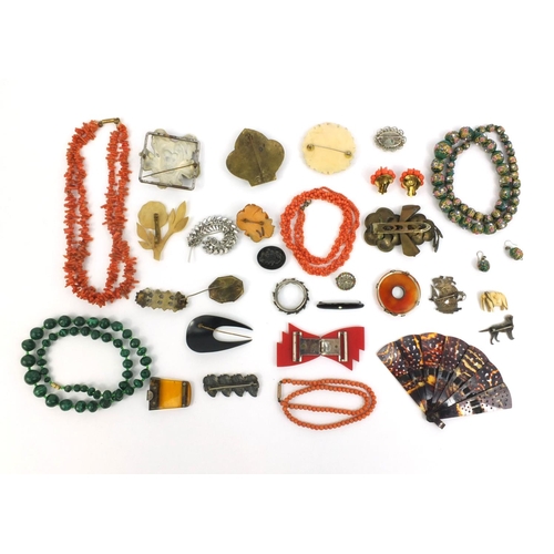 843 - Assorted jewellery including a Scottish hard stone brooch, coral necklace, hand painted glass bead n... 