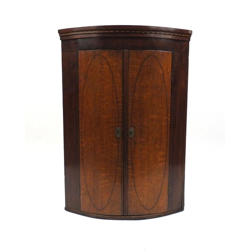 6 - **DESCRIPTION AMMENDED 3-3-17** Georgian inlaid mahogany bow fronted corner cupboard, fitted with th... 