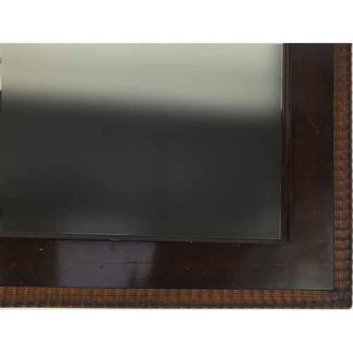28 - Rectangular oak framed bevelled edge wall hanging mirror and one other, the larger 64cm x 43cm