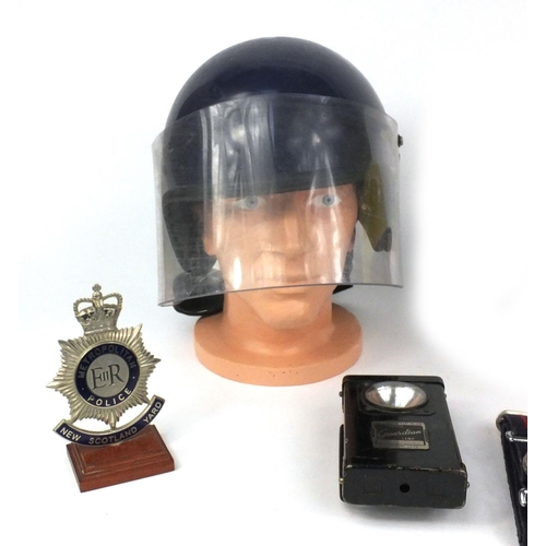 613 - Group of police, Military and firemen's interest items comprising Scotland Yard Police badge, a tin ... 