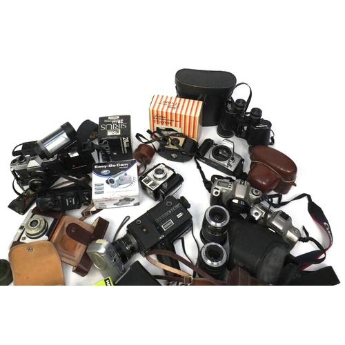 112 - Collection of assorted cameras and accessories including Praktica Llc, Yashica and Pentax examples