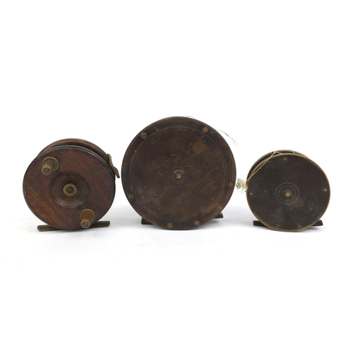 117 - Three Victorian wooden and brass fishing reels, together with some vintage flies, the reels includin... 